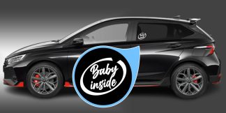 Baby inside Aufkleber als originelles und geniales Auto-Tribal in Weiß auf schwarzer Auto-Seitenscheibe